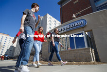 Harper Dining Center photo shoot. Students socializing outside Herbie's Market near Harper Dining Ce