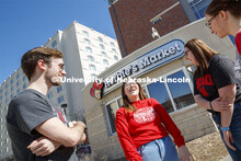 Harper Dining Center photo shoot. Students socializing outside Herbie's Market near Harper Dining Ce
