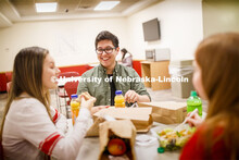 Selleck Dining Center photo shoot. Students socializing and eating a meal at the Selleck Dining Cent