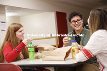 Selleck Dining Center photo shoot. Students socializing and eating a meal at the Selleck Dining Cent