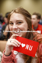 Sheridan Macy, a senior in political science and history, shows off her "I love NU" postcard at the 