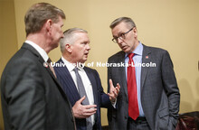 Regent Timothy Clare, center, talks with NU President Ted Carter at left and UNL Chancellor Ronnie G