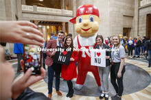 Lil' Red poses with UNL students in the rotunda. NU Advocacy Day at the Capitol. March 10, 2020. 