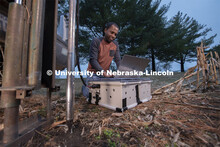 Nuwan Wijewardane, postdoctoral researcher in biological systems engineering, prepares to gather dat