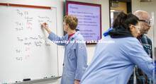 Bailey McLean, junior in biological sciences, record the experiment data in the Chem 110 lab on entr