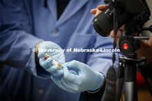 A litmus strip which shows the ph balance for the solution is shown to the camera during a chemistry