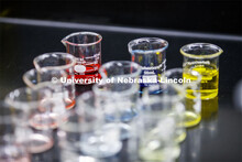 Beakers of liquids for future labs await their turn in the spotlight. As a result of the Corona viru