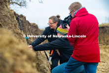 Judith Turk and Rebecca Young (stocking hat), assistant professors of natural resources, are being v