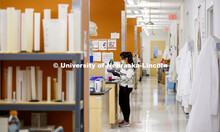 Yafan You mixes a solution in Kurt Piepenbrink's Nebraska Food for Health Center lab. Because of the