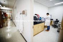 Qinnan Bob Yang extracts DNA from a fecal sample as works in Andrew Benson's Nebraska Food for Healt