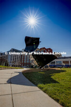 The sun shines in the blue sky above the Torn Notebook sculpture on city campus. March 30, 2020. 