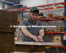 Max Wheeler, Shop Instructional Technician at Nebraska Innovation Studio, assembles face shields wit