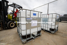 Russell Parde drives a forklift after lowering a container of hand sanitizer after it was emptied in