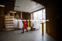Hunter Flodman pulls a container of nonflammable ingredients into the Food Innovation Center so they