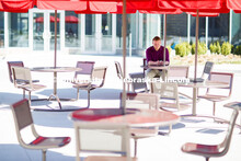 David Strang with ASEM takes part in a Zoom meeting from the shade of the tables outside Willa Cathe