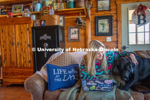Katie Bresnahan does remote learning from her home in Hordville, NE, despite distractions from her d