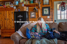 Katie Bresnahan does remote learning from her home in Hordville, NE, despite distractions from her d