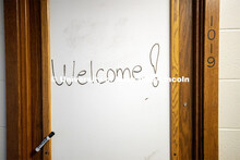 “Welcome!” is written on a marker board outside a room in Harper Hall. To enable first responder