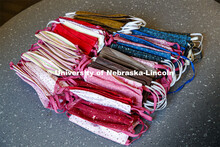 Veronica Riepe, director of student involvement, counts donated masks at University Suites before th