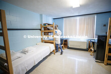 Cheryl Duncan, Residence Hall Custodial Leader with University Housing wears personal protective equ