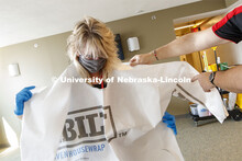 Cheryl Duncan, Residence Hall Custodial Leader with University Housing dons personal protective equi
