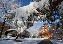 Fragment X-O, by Juan Hamilton in the Sheldon Sculpture Garden, is covered in a layer of snow. Archi