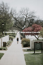 A young woman jogs across City Campus, which is empty, due to COVID-19. April 22, 2020. 