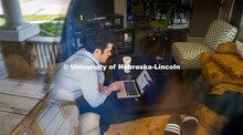 Zack Beyers, senior in Advertising and Public Relations and Sports Media and Communication, gives hi