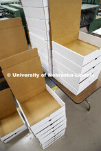 Printing Service employees work to fill the Go Big Grad boxes. Graduates will receive a "Go Big Grad