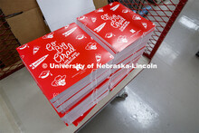 Printing Service employees work to fill the Go Big Grad boxes. Graduates will receive a "Go Big Grad
