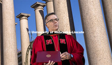 Chancellor Ronnie Green delivers his virtual commencement remarks front of the columns at the produc