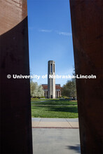 The Mueller Bell Tower is framed by Greenpoint sculpture on City Campus. April 30, 2020. 