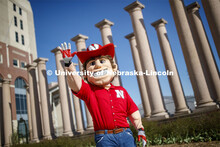 Herbie Husker in front of the columns by Memorial Stadium. On campus. April 30, 2020. 