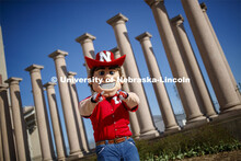 Herbie Husker in front of the columns by Memorial Stadium. On campus. April 30, 2020. 