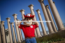 Herbie Husker in front of the columns by Memorial Stadium. On campus. April 30, 2020. 
