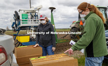 Research Manager Christine Smith explains the planting order to Brandi Sigmon, Assistant Professor o