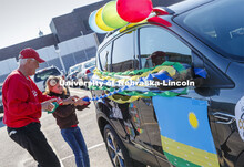 Ratch O'Connell and his granddaughter, Elisa Peters, decorate their vehicle before the parade. Blue,
