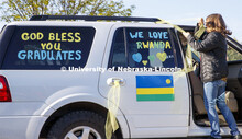 Brenda Menter decorates her vehicle before the parade. Christ Place Church families gave the Rwandan