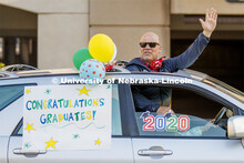 Brad Novasad uses the sunroof to wave to the students. Christ Place Church families gave the Rwandan