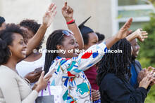 Oscaline Usanase, graduating with an Integrated Science degree, waves to the parade. Christ Place Ch