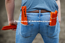 Nate Pester pockets are filled with row markers while setting up the next section to be planted. Jam