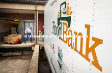 Calvin Schrock, research manager in Animal Science, pulls a pallet load of processed pork toward the