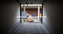 Calvin Schrock, research manager in Animal Science, maneuvers a pallet load of processed pork toward