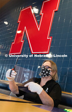 Dinning Services employees, Rochan Pinho, Janet Nichols and Dami Olsen, assemble face shields at Har