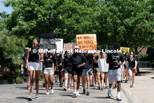 Protestors begin their march from the Nebraska Union to the Nebraska State Capitol on Saturday, June