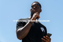 Former Nebraska football safety Kieron Williams delivers a speech to the crowd outside of the Nebras