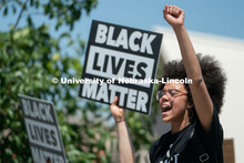 Marshawna Kapke leads protestors in a chant during their march from the Nebraska Union to the Nebras