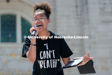 Marshawna Kapke recites a poem to the crowd of protestors outside the Nebraska State Capitol on Satu