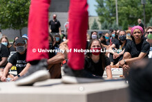 Protestors listen as Kossi Joel Kouakou delivers a speech outside of Andersen Hall on Saturday, June
