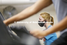 Ellenor Sell works out wearing her mask on the first day of Campus Recreation re-opening after being